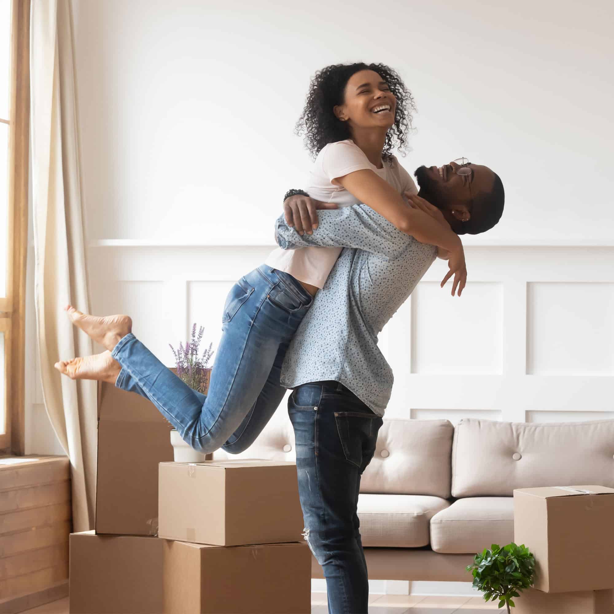 couple happy and hugging in their new home